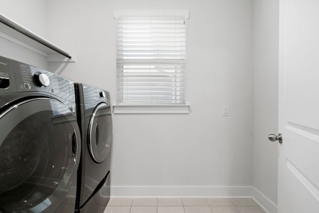 265 Tierra Trl, Dripping Springs, TX 78620 - laundry area with washing machine and clothes dryer, light tile patterned floors, and healthy amount of natural light