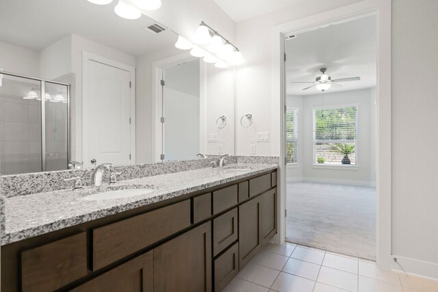 265 Tierra Trl, Dripping Springs, TX 78620 - bathroom featuring double vanity, ceiling fan, tile patterned floors, and tiled shower
