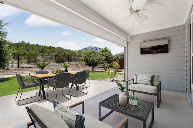 265 Tierra Trl, Dripping Springs, TX 78620 - fenced backyard featuring outdoor dining space, a ceiling fan, a patio area, and an outdoor living space