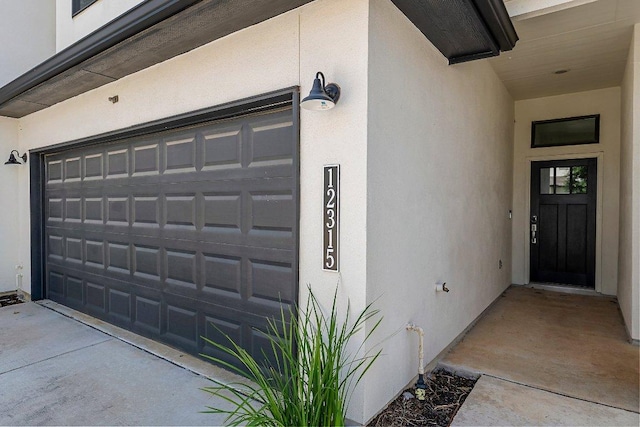 12315 Maypole Bnd Unit 1002, Austin, TX 78717 - doorway to property featuring stucco siding and a garage