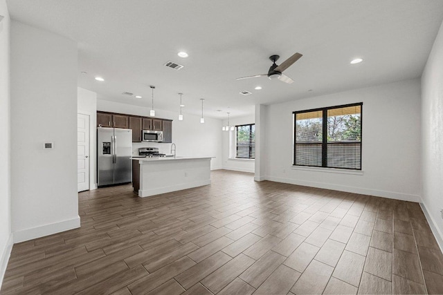 12315 Maypole Bnd Unit 1002, Austin, TX 78717 - unfurnished living room with ceiling fan, dark wood-style floors, and recessed lighting