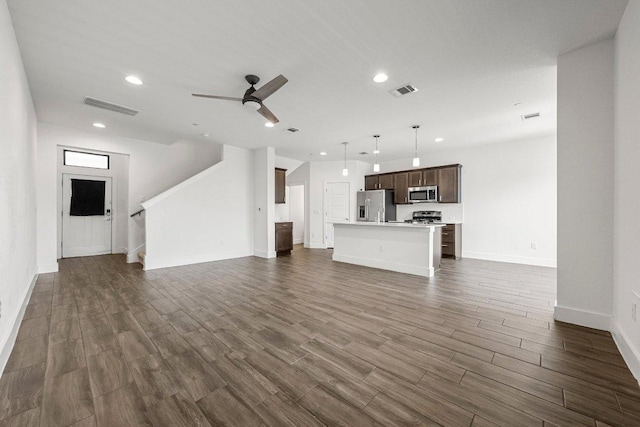 12315 Maypole Bnd Unit 1002, Austin, TX 78717 - unfurnished living room featuring dark wood-style flooring, a ceiling fan, recessed lighting, and stairway