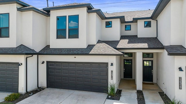 12315 Maypole Bnd Unit 1002, Austin, TX 78717 - view of property with concrete driveway, stucco siding, an attached garage, and roof with shingles