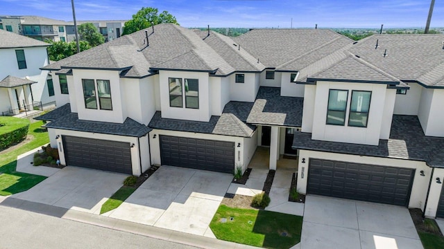 12315 Maypole Bnd Unit 1002, Austin, TX 78717 - view of front of house featuring a garage, stucco siding, and driveway