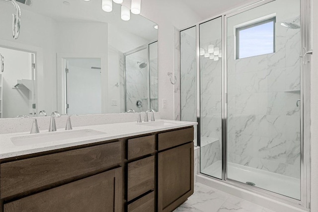 12315 Maypole Bnd Unit 1002, Austin, TX 78717 - bathroom featuring a marble finish shower, marble finish flooring, and double vanity