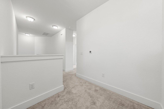 12315 Maypole Bnd Unit 1002, Austin, TX 78717 - unfurnished room with light carpet and baseboards
