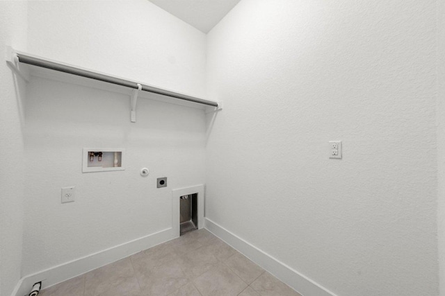 12315 Maypole Bnd Unit 1002, Austin, TX 78717 - washroom featuring electric dryer hookup, hookup for a washing machine, gas dryer hookup, and light tile patterned flooring