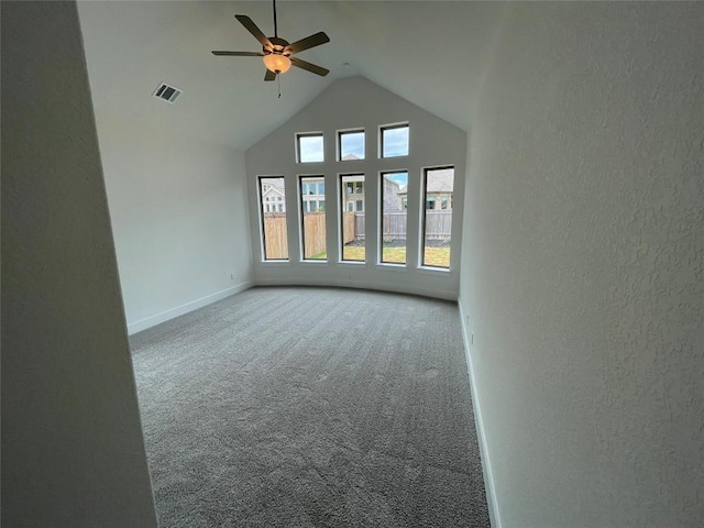 221 Camille St, Leander, TX 78641 - spare room with carpet flooring, a ceiling fan, high vaulted ceiling, and a textured wall