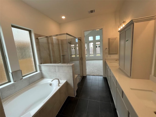 221 Camille St, Leander, TX 78641 - full bath with tile patterned flooring, a garden tub, a stall shower, vanity, and recessed lighting