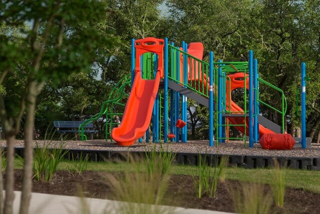 221 Camille St, Leander, TX 78641 - community play area with view of wooded area