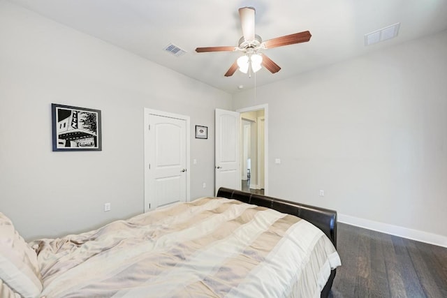 3105 Mccurdy St, Austin, TX 78723 - bedroom with dark wood-style floors and a ceiling fan