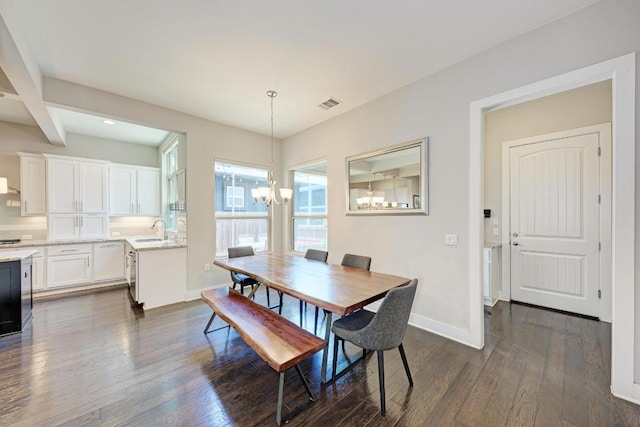 3105 Mccurdy St, Austin, TX 78723 - dining space featuring a chandelier, dark wood finished floors, recessed lighting, and beamed ceiling