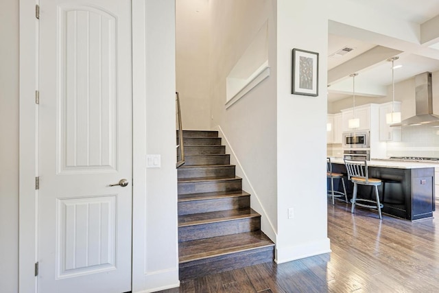 3105 Mccurdy St, Austin, TX 78723 - stairway with wood finished floors and beam ceiling