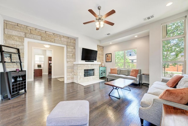 3105 Mccurdy St, Austin, TX 78723 - living area with a ceiling fan, dark wood finished floors, a fireplace, and recessed lighting