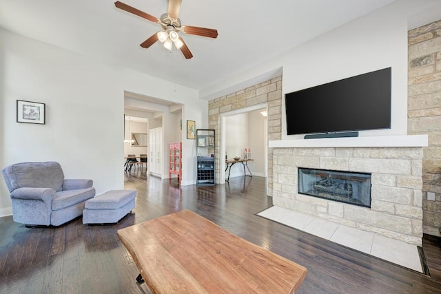3105 Mccurdy St, Austin, TX 78723 - living area with ceiling fan, a fireplace, and wood finished floors