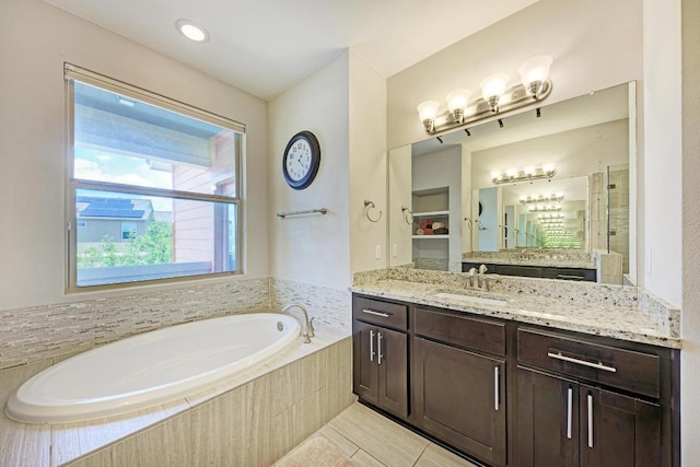 3105 Mccurdy St, Austin, TX 78723 - full bath featuring a garden tub, vanity, and tile patterned flooring