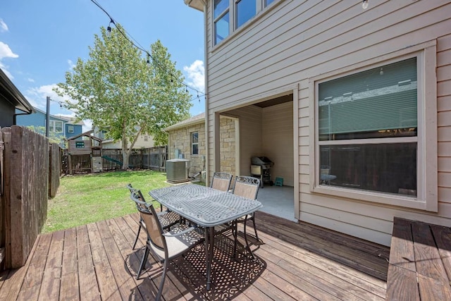 3105 Mccurdy St, Austin, TX 78723 - wooden deck with a fenced backyard, outdoor dining area, and a grill