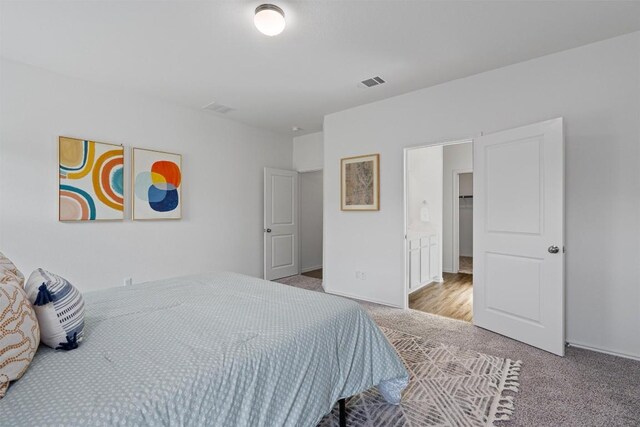 929 Wildrye Ct, Leander, TX 78641 - carpeted bedroom with baseboards