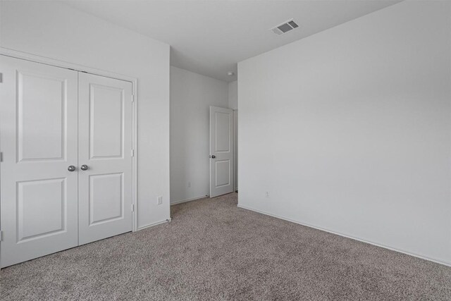 929 Wildrye Ct, Leander, TX 78641 - unfurnished bedroom featuring carpet flooring and a closet