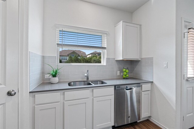 929 Wildrye Ct, Leander, TX 78641 - kitchen featuring dishwasher, white cabinets, plenty of natural light, and backsplash