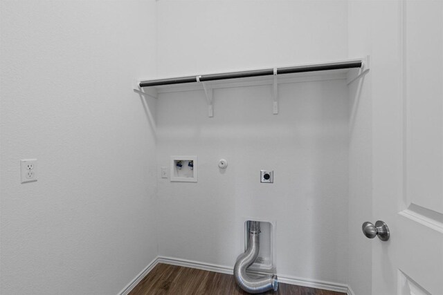 929 Wildrye Ct, Leander, TX 78641 - laundry room featuring hookup for a gas dryer, electric dryer hookup, washer hookup, and dark wood-style flooring
