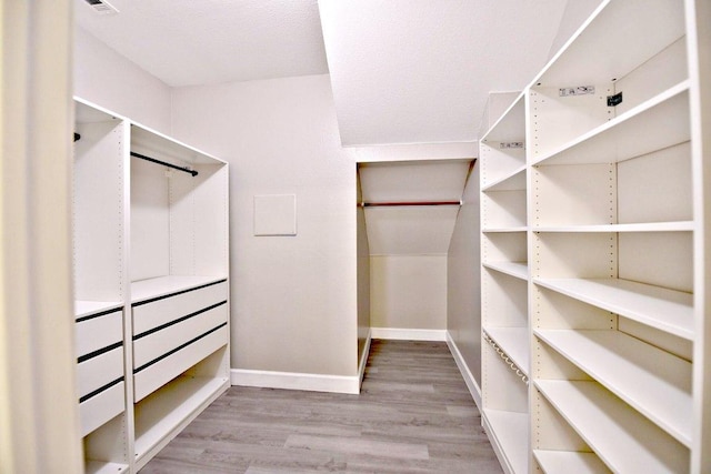 1933 Chasewood Dr, Austin, TX 78727 - walk in closet featuring wood finished floors