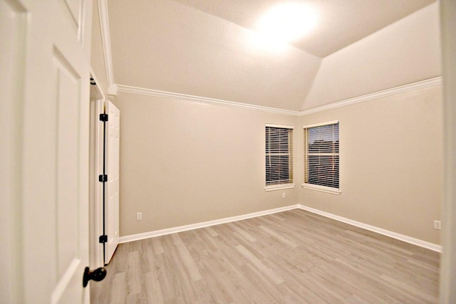 1933 Chasewood Dr, Austin, TX 78727 - unfurnished room with light wood-style floors, lofted ceiling, and crown molding