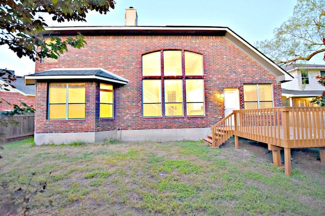 1933 Chasewood Dr, Austin, TX 78727 - back of property featuring brick siding, a deck, and a chimney