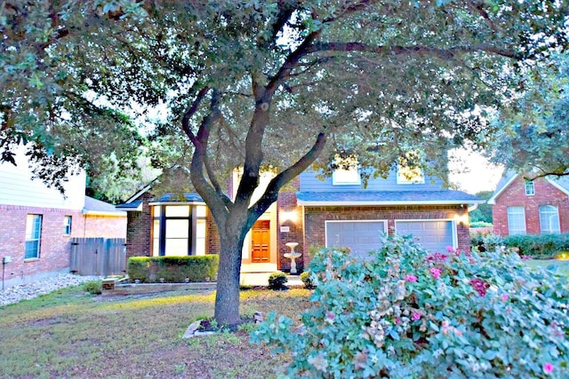 1933 Chasewood Dr, Austin, TX 78727 - view of front of home featuring brick siding and an attached garage
