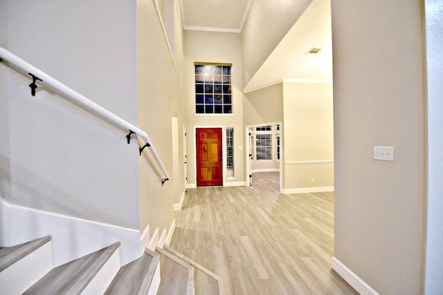 1933 Chasewood Dr, Austin, TX 78727 - foyer entrance with wood finished floors, crown molding, and a high ceiling