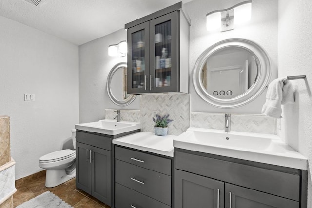 507 S Lake Creek Dr, Round Rock, TX 78681 - full bathroom featuring two vanities, tasteful backsplash, and tile patterned floors