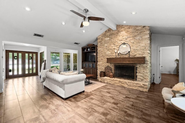 507 S Lake Creek Dr, Round Rock, TX 78681 - living area with a stone fireplace, ceiling fan, wood finished floors, and recessed lighting