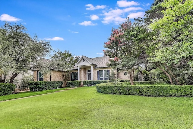 3110 Barton Point Dr, Austin, TX 78733 - view of front of home with brick siding and a front yard