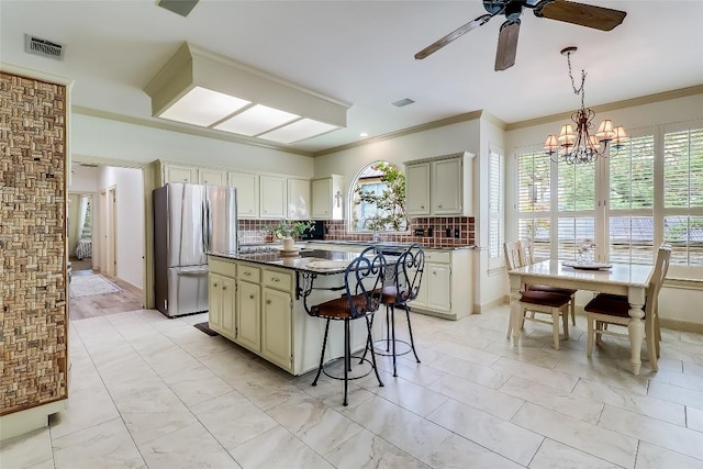 3110 Barton Point Dr, Austin, TX 78733 - kitchen with freestanding refrigerator, dark countertops, plenty of natural light, ceiling fan, and ornamental molding
