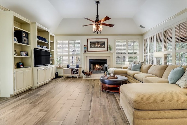3110 Barton Point Dr, Austin, TX 78733 - living room featuring light wood-style flooring, ceiling fan, lofted ceiling, and a tiled fireplace