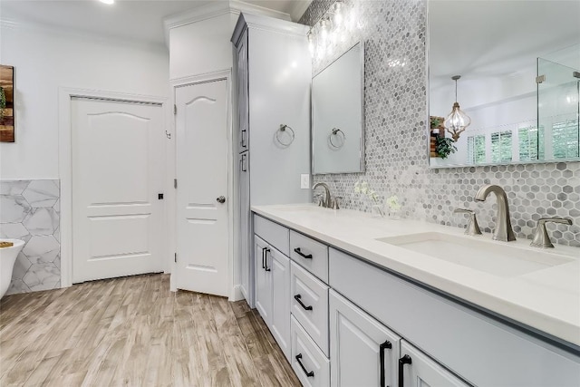 3110 Barton Point Dr, Austin, TX 78733 - full bath featuring double vanity, wood finished floors, and tasteful backsplash
