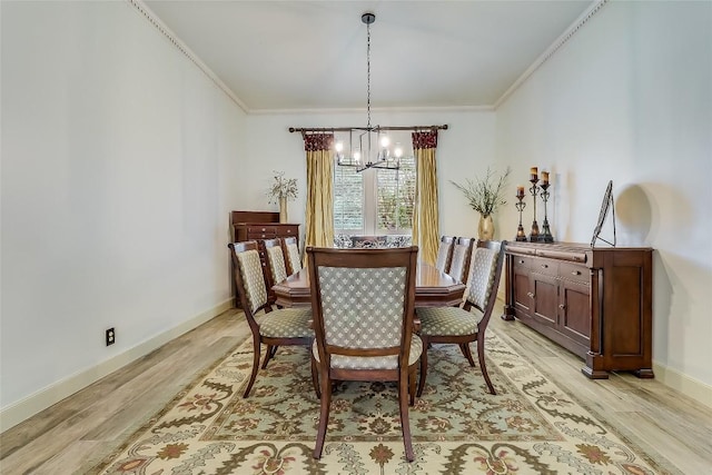 3110 Barton Point Dr, Austin, TX 78733 - dining space with a chandelier, light wood-style flooring, and crown molding