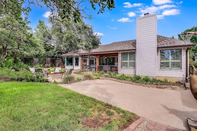 3110 Barton Point Dr, Austin, TX 78733 - back of property featuring a patio area and a chimney