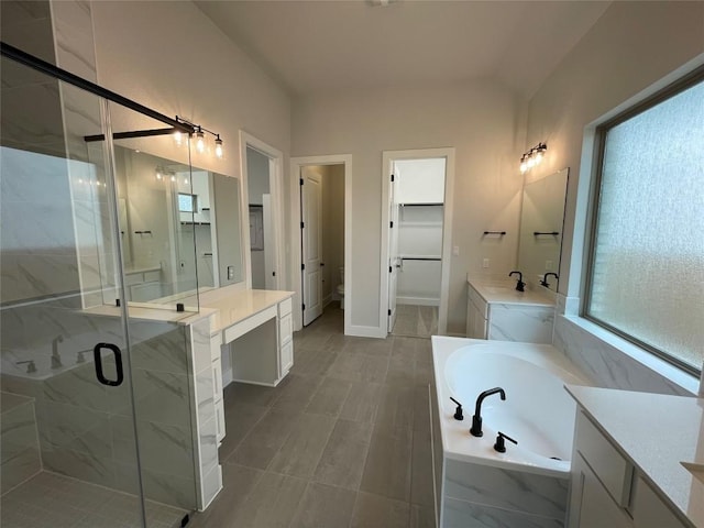 1824 Camay St, Leander, TX 78641 - bathroom featuring a bath, vanity, and a marble finish shower