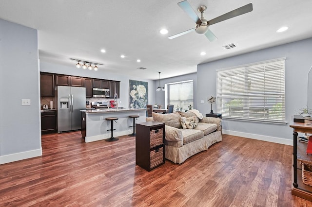 204 Parable Cv, Pflugerville, TX 78660 - living room with ceiling fan, dark wood-type flooring, and recessed lighting