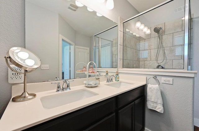 204 Parable Cv, Pflugerville, TX 78660 - full bathroom featuring double vanity and a tile shower
