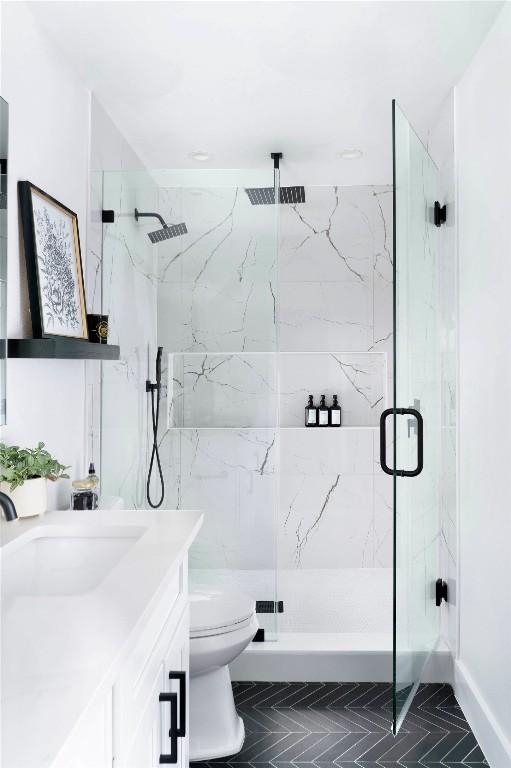 5806 Burnhill Dr, Austin, TX 78745 - full bath with a marble finish shower and vanity