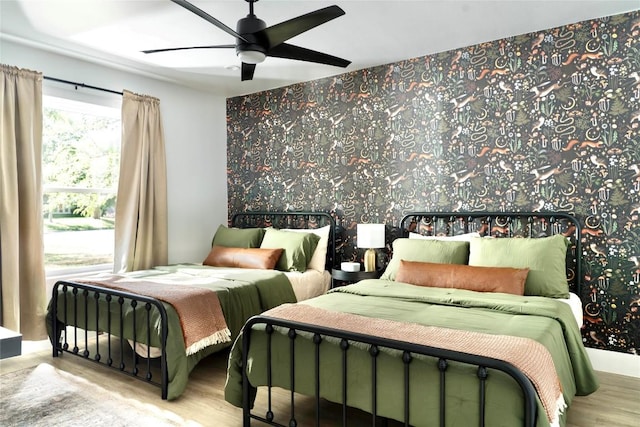 5806 Burnhill Dr, Austin, TX 78745 - bedroom featuring wood finished floors and ceiling fan
