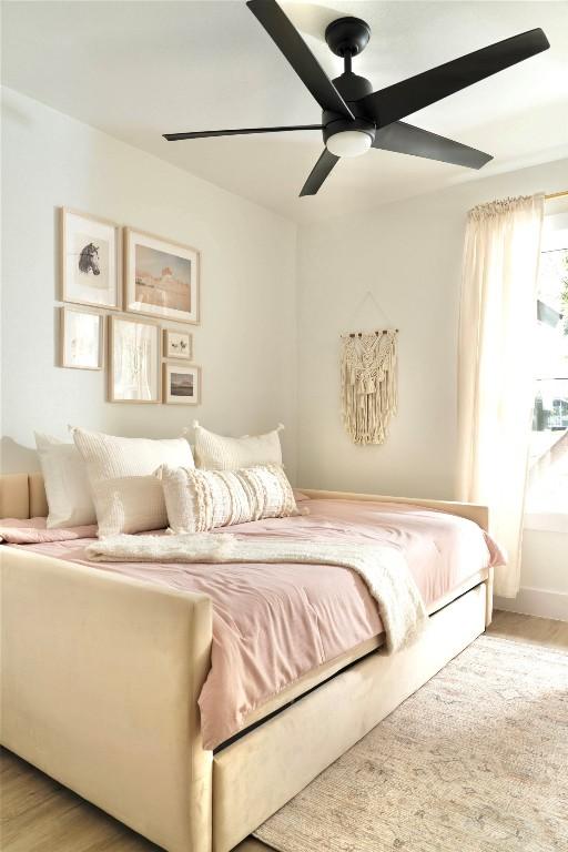 5806 Burnhill Dr, Austin, TX 78745 - bedroom with wood finished floors and a ceiling fan