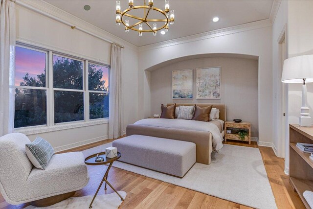 6717 Valburn Dr, Austin, TX 78731 - bedroom with a chandelier, light wood-type flooring, and crown molding