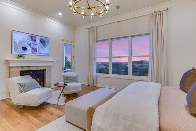 6717 Valburn Dr, Austin, TX 78731 - bedroom featuring a chandelier, wood finished floors, crown molding, access to outside, and a premium fireplace