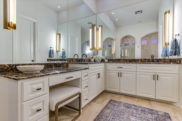 6717 Valburn Dr, Austin, TX 78731 - full bathroom with double vanity, recessed lighting, and stone tile flooring