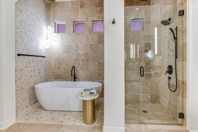 6717 Valburn Dr, Austin, TX 78731 - bathroom with a shower stall and a freestanding tub