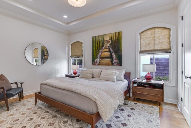 6717 Valburn Dr, Austin, TX 78731 - bedroom featuring multiple windows, crown molding, light wood finished floors, recessed lighting, and a raised ceiling