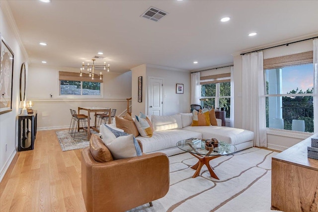 6717 Valburn Dr, Austin, TX 78731 - living area with wood finished floors, a chandelier, recessed lighting, and ornamental molding